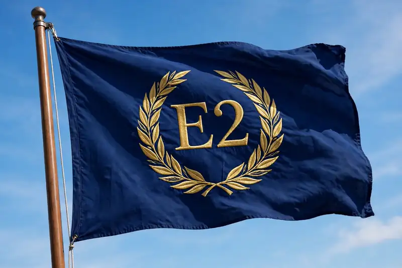 The E2 flag: navy blue with gold laurel wreath